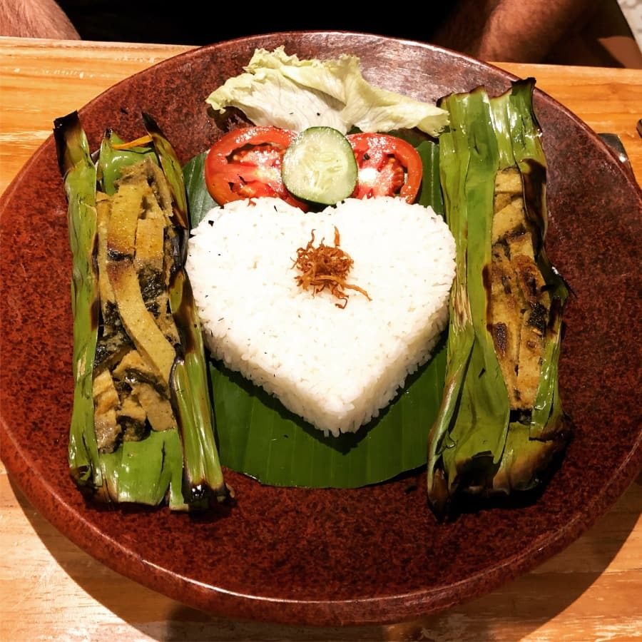 janis_vegan_corner_2 vegan meat cooked in banana leaves at janis vegan corner in ubud, bali, indonesia.