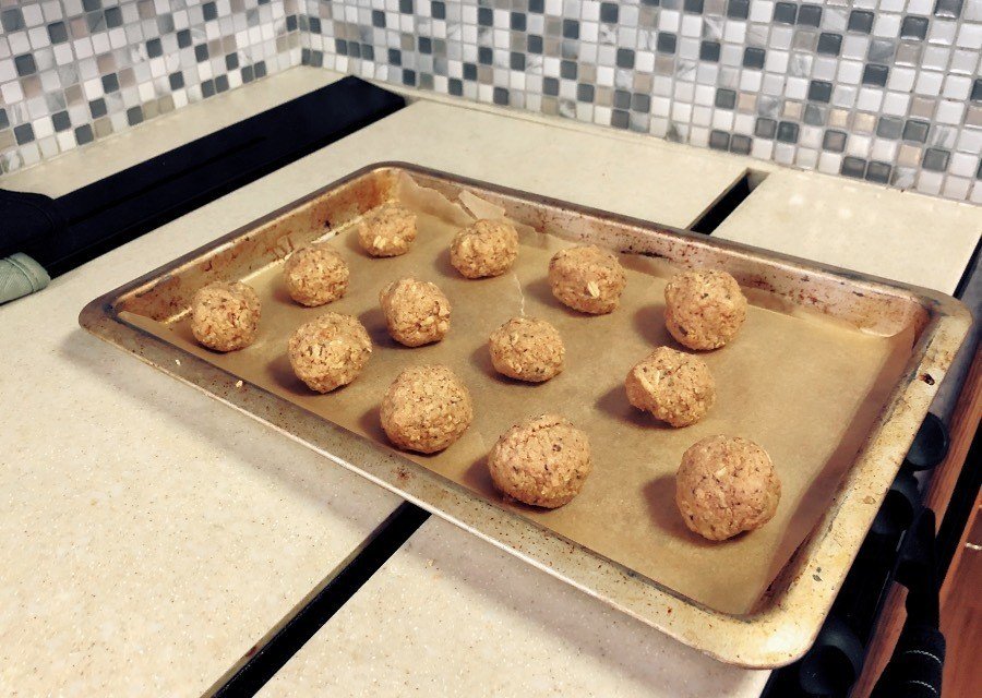 vegan-meatballs-baking-sheet vegan meatballs on a baking sheet.